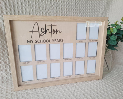 Wooden photo frame with multiple slots labeled for 'My School Years' on a textured wall background.