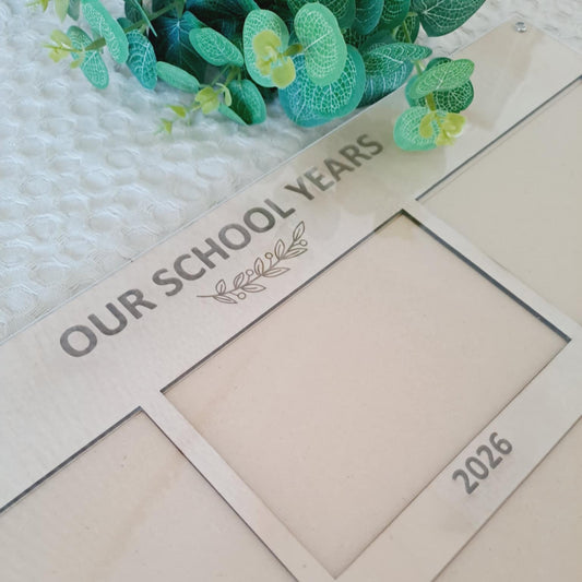 Natural timber sibling school frame with clear acrylic front and engraved detailing.